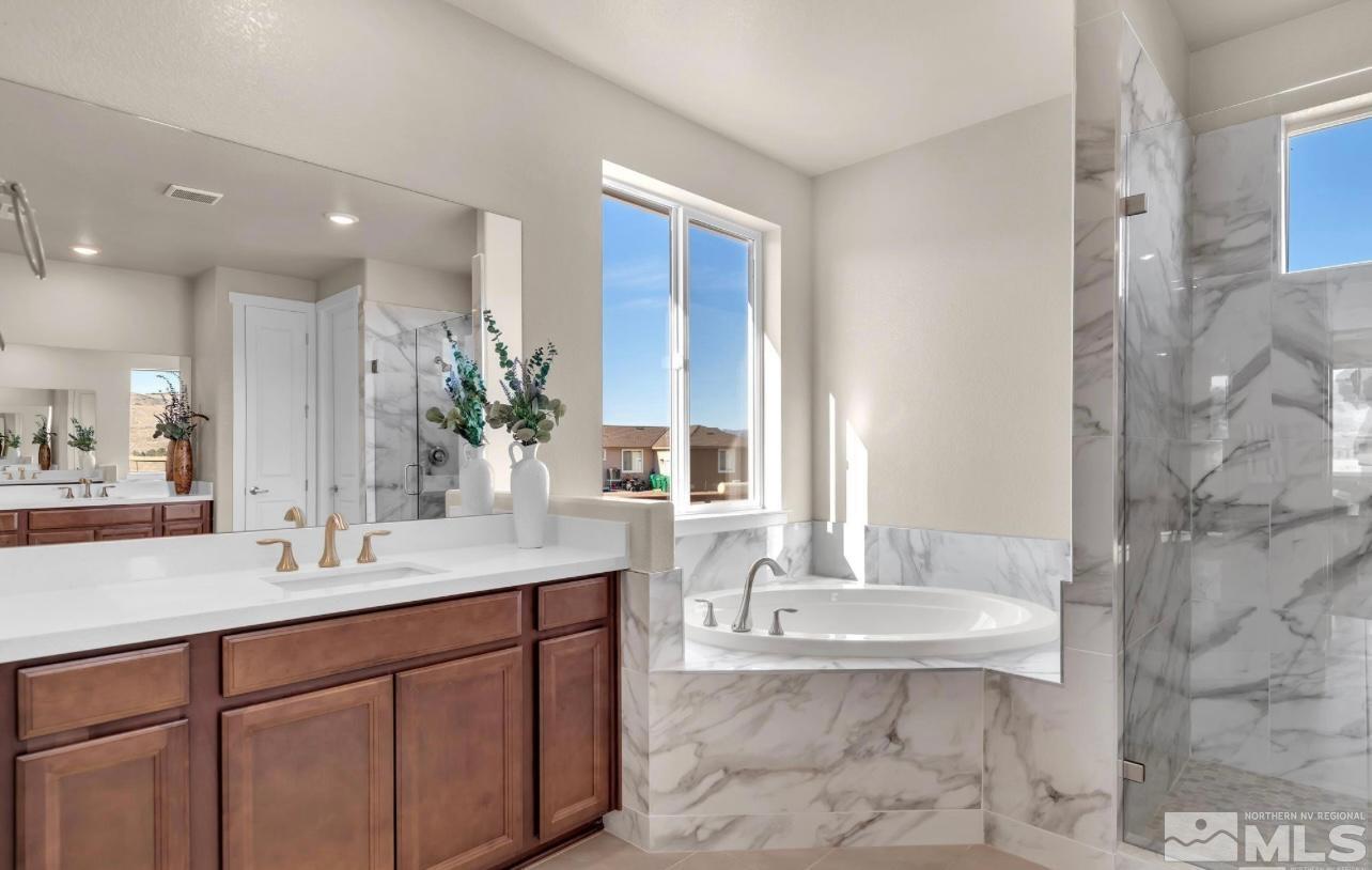 200 Paloma Ranch Court Reno, NV 89510 - Photo 19 of 27 a bathroom with a granite countertop sink a toilet a mirror and shower