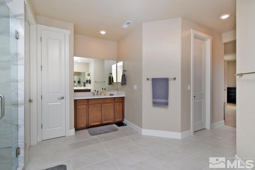 200 Paloma Ranch Court Reno, NV 89510 - Photo 21 of 27 a view of a hallway with bathroom and a sink