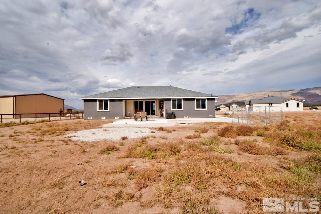 200 Paloma Ranch Court Reno, NV 89510 - Photo 27 of 27 a backyard of a house with table and chairs
