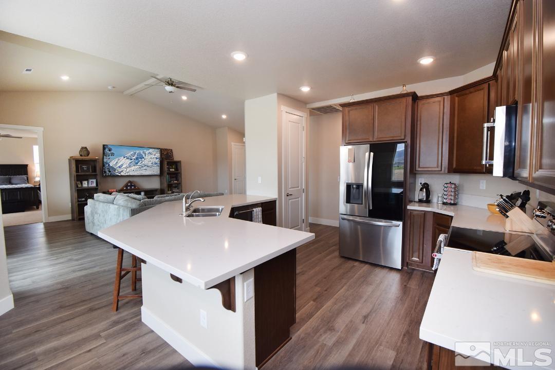 200 Paloma Ranch Court Reno, NV 89510 - Photo 7 of 27 a large kitchen with a table chairs refrigerator and a sink