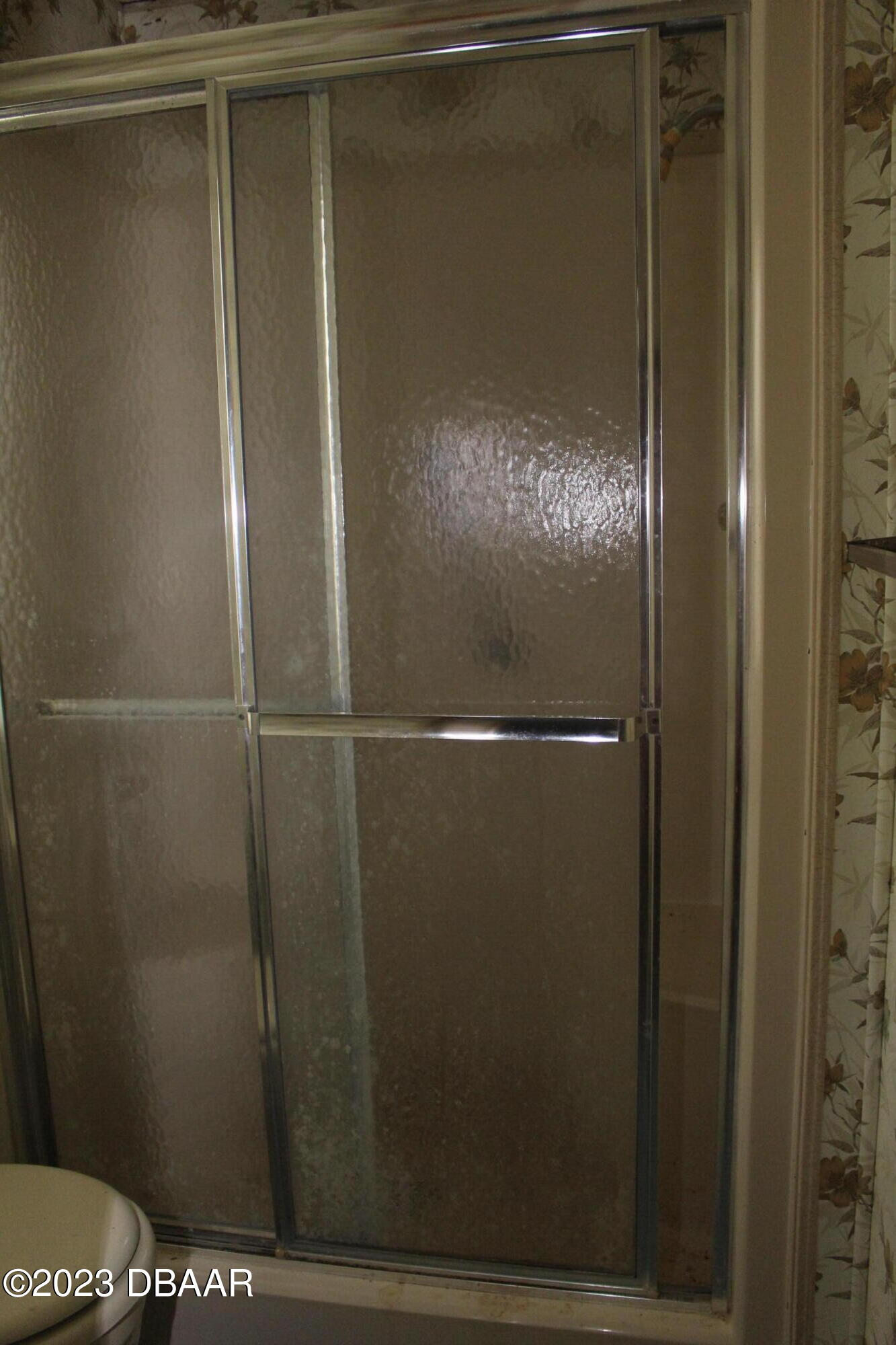 780 Rolling Hills Drive Port Orange, FL 32129 - Photo 14 of 15 a bathroom with a glass door