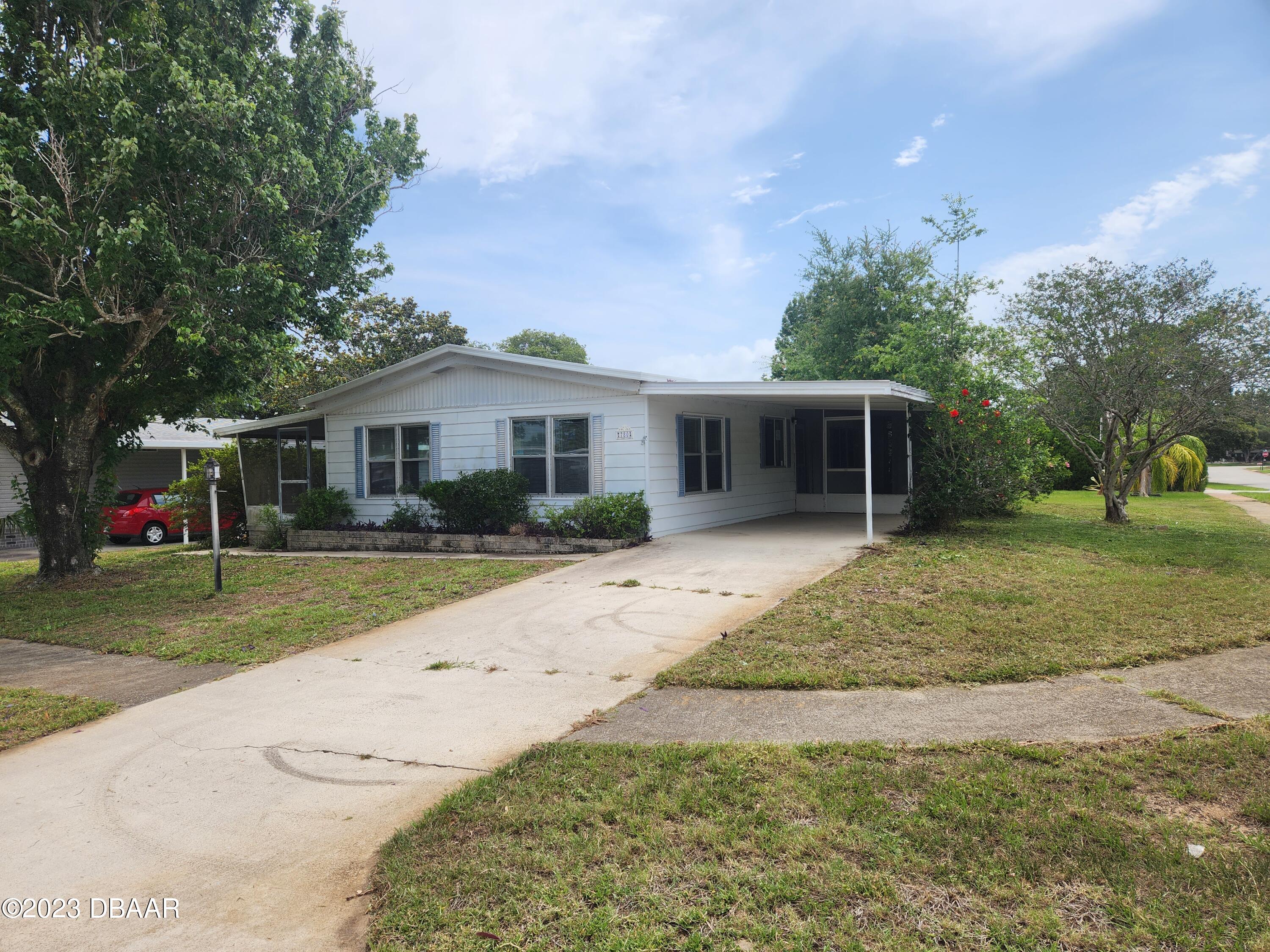 780 Rolling Hills Drive Port Orange, FL 32129 - Photo 15 of 15 front view of a house with a yard