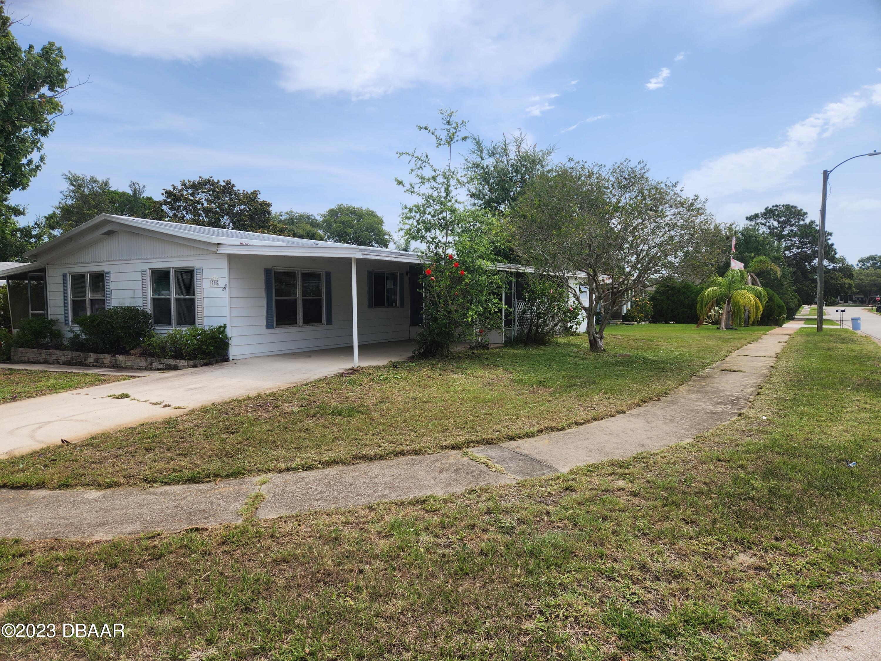 780 Rolling Hills Drive Port Orange, FL 32129 - Photo 2 of 15 a view of a house with a yard