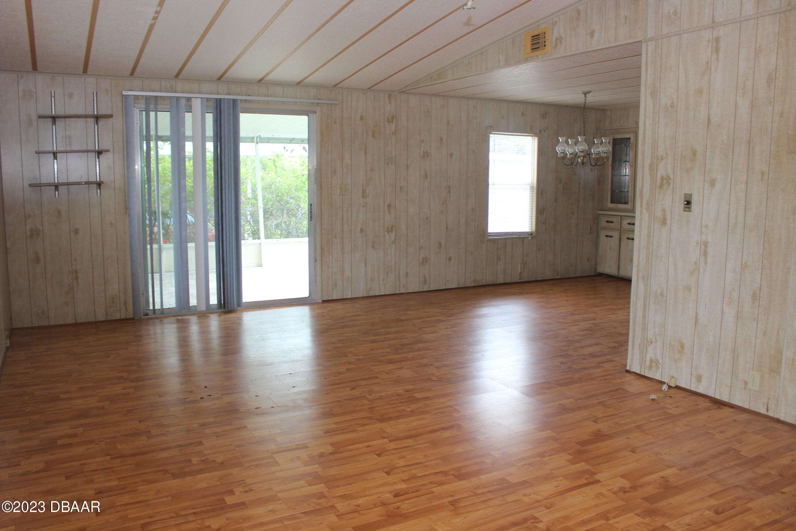 780 Rolling Hills Drive Port Orange, FL 32129 - Photo 7 of 15 a view of a livingroom with wooden floor and window