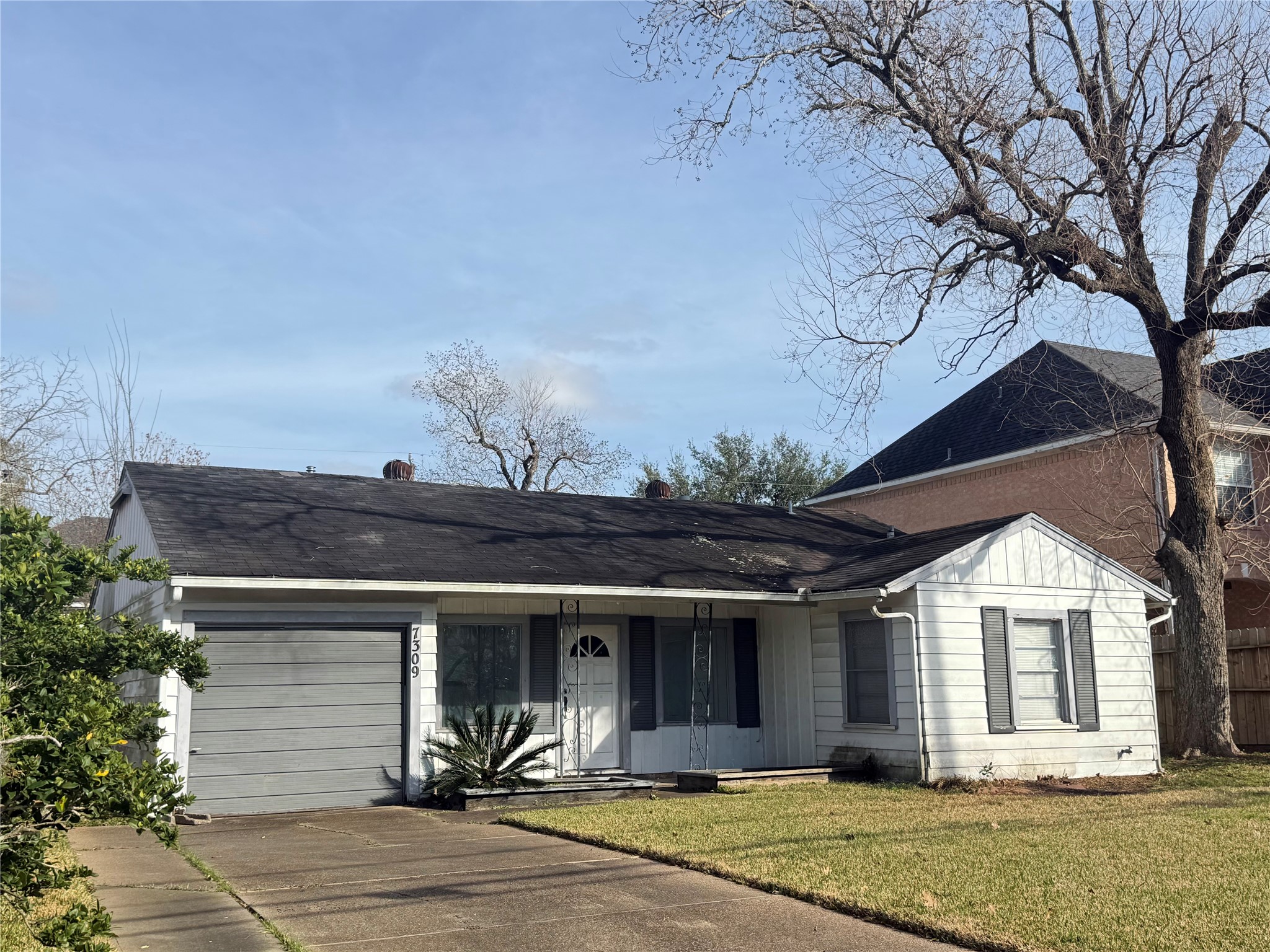 7309 South Rice Avenue Bellaire, TX 77401 - Photo 2 of 6 a view of a house with a backyard