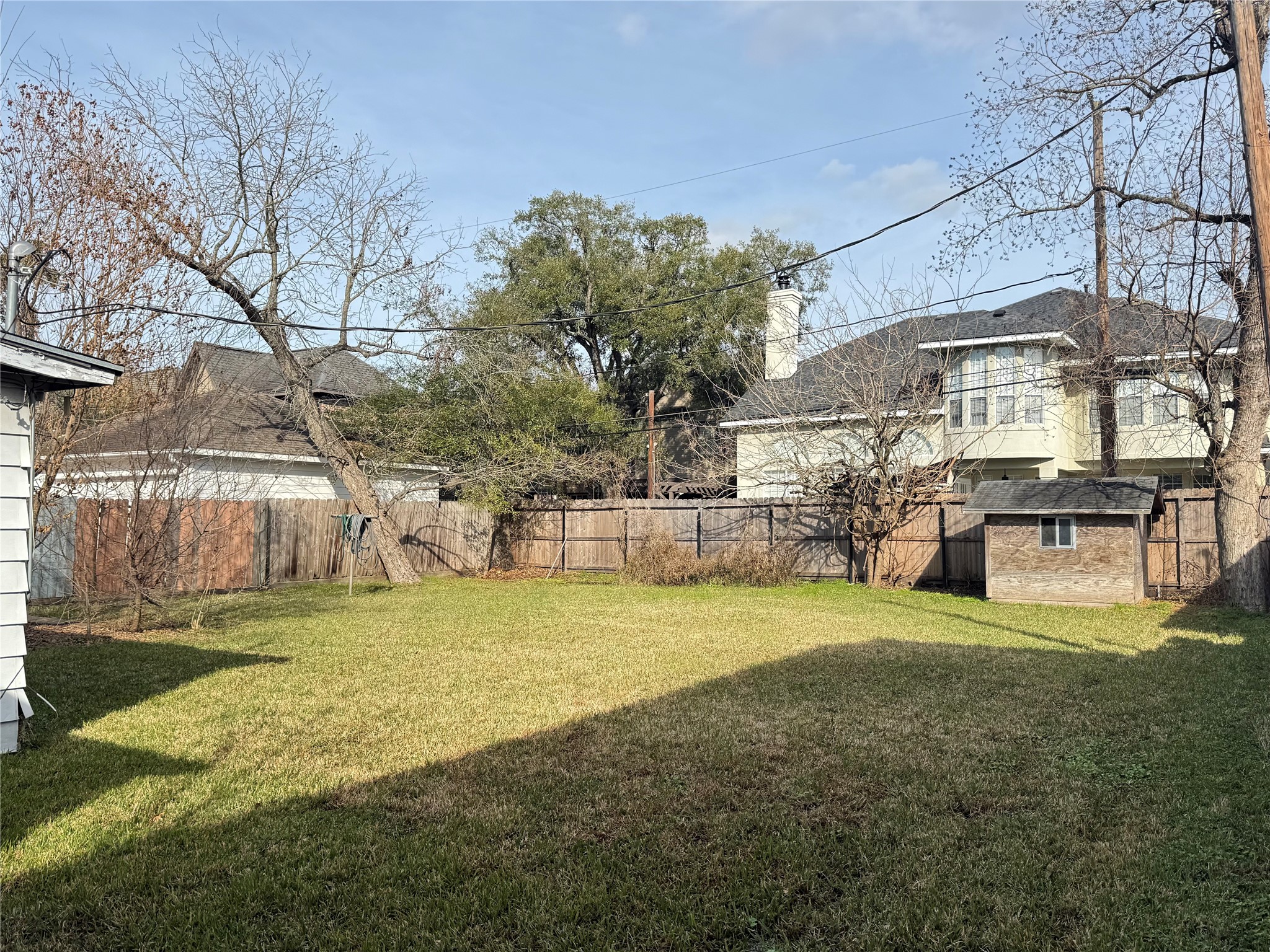 7309 South Rice Avenue Bellaire, TX 77401 - Photo 4 of 6 a view of a swimming pool with an outdoor space and seating area