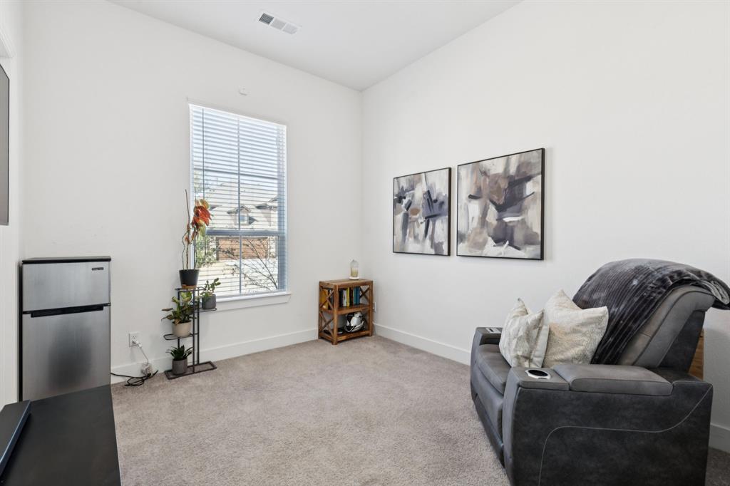 1903 Midhurst Drive Forney, TX 75126 - Photo 19 of 31 a living room with furniture and a window
