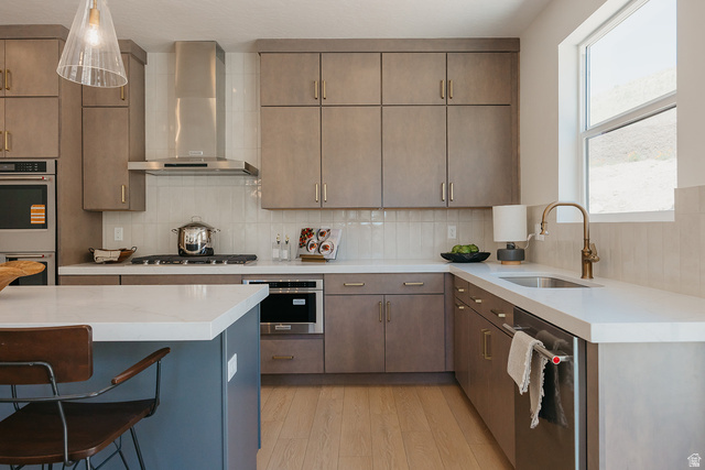 5902 Canyon Rim Road, Unit 620 Lehi, UT 84048 - Photo 15 of 78 Modern kitchen featuring light wood-finish flooring, white countertops, and contemporary gray cabinetry