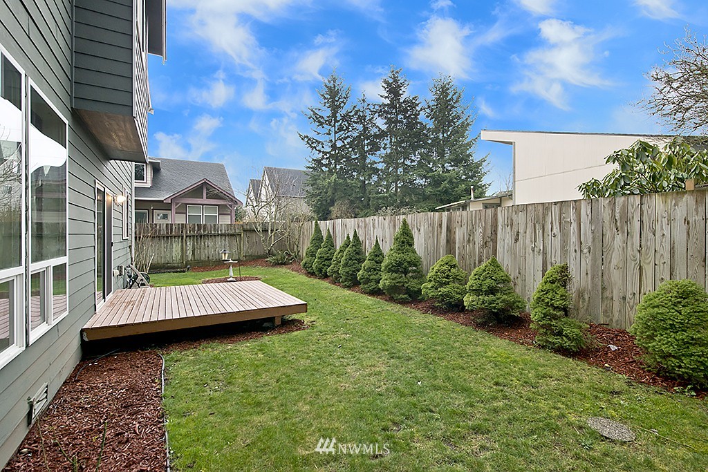 1402 Queen Avenue Northeast Renton, WA 98056 - Photo 22 of 25 a view of backyard with swimming pool and outdoor seating