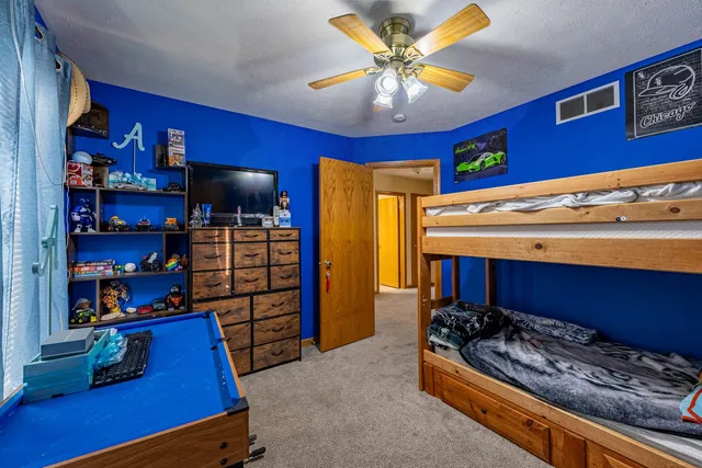 a room with furniture and a bookshelf