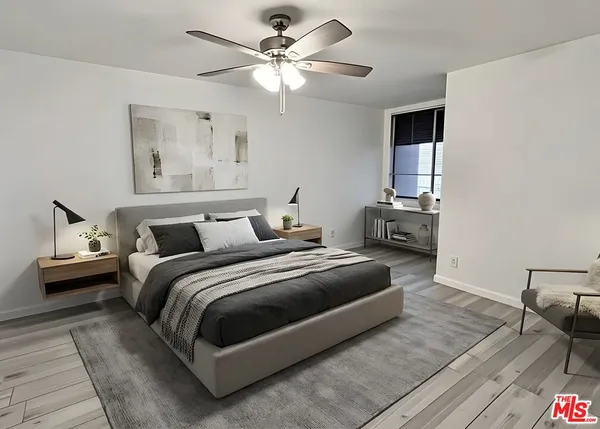 a bedroom with bed and window