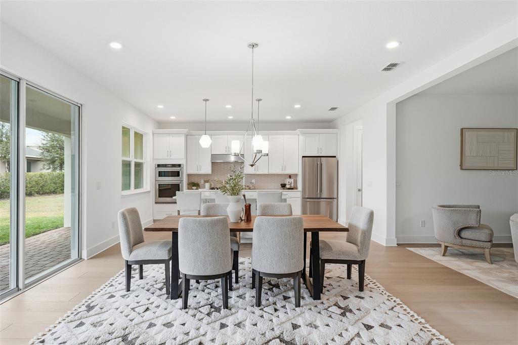2430 Park Ridge Street Apopka, FL 32712 - Photo 13 of 49 a view of a dining room with furniture