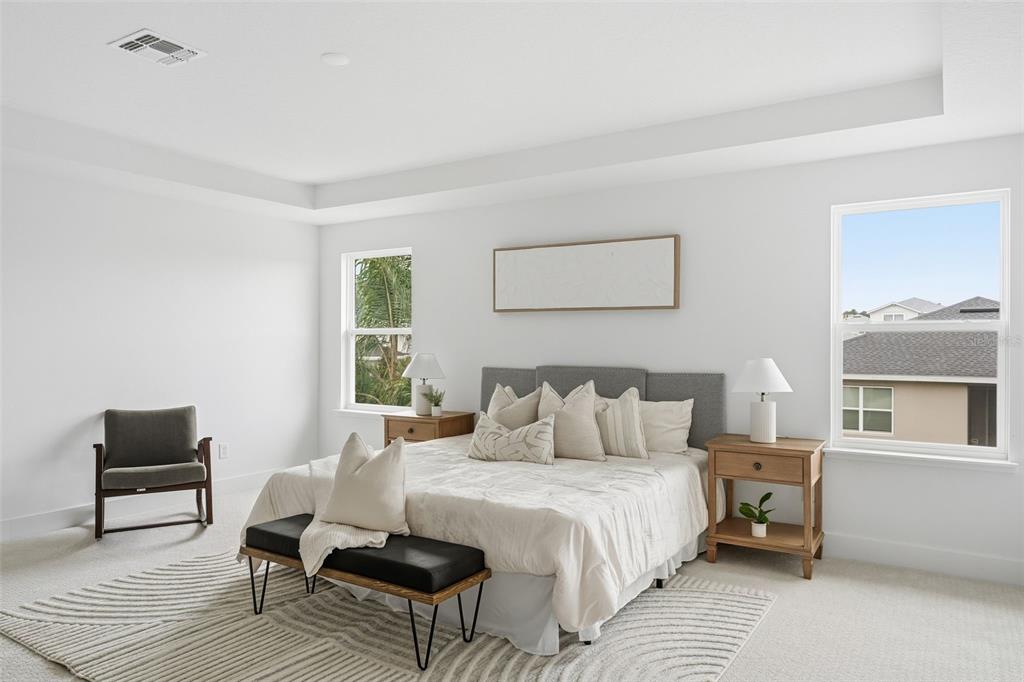 2430 Park Ridge Street Apopka, FL 32712 - Photo 20 of 49 a bedroom with a bed a couch and a window