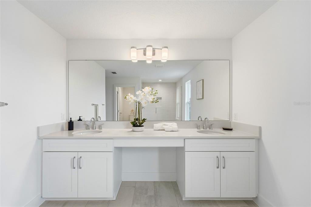 2430 Park Ridge Street Apopka, FL 32712 - Photo 21 of 49 a bathroom with a sink vanity and a mirror