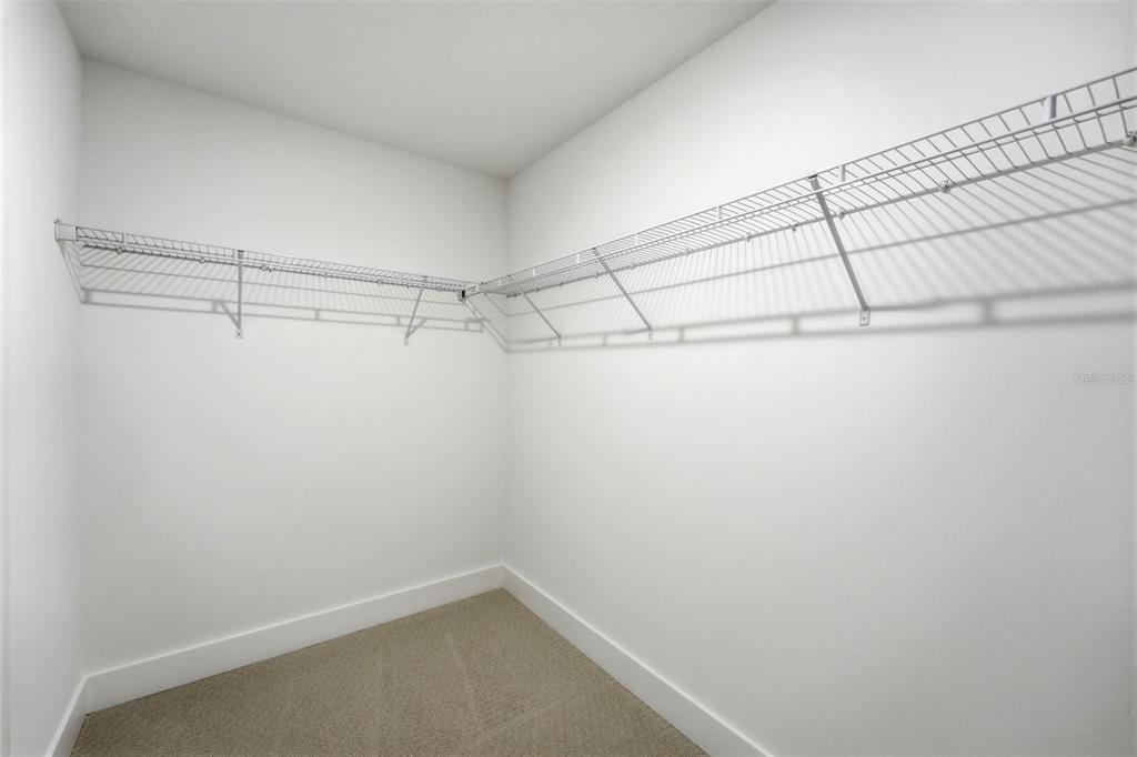 2430 Park Ridge Street Apopka, FL 32712 - Photo 23 of 49 a view of a room with racks on the wall
