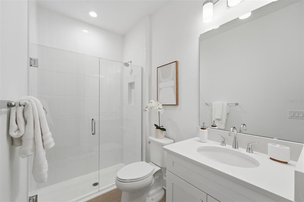 2430 Park Ridge Street Apopka, FL 32712 - Photo 7 of 49 a bathroom with a sink toilet and shower