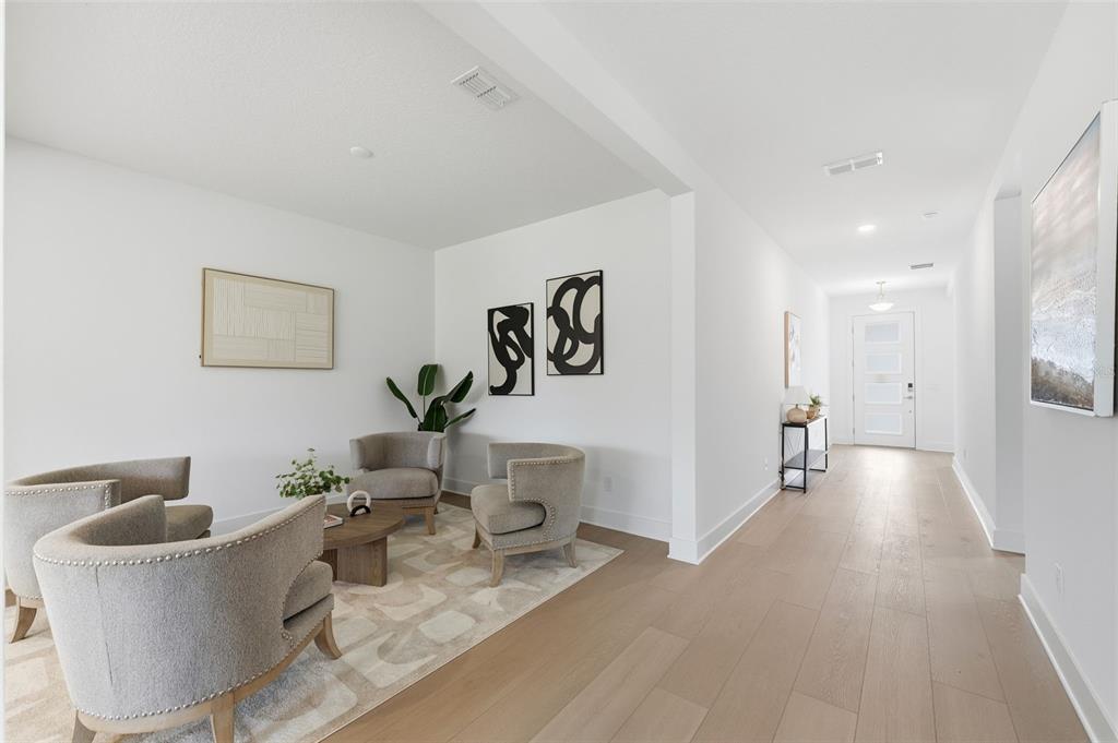 2430 Park Ridge Street Apopka, FL 32712 - Photo 8 of 49 a living room with furniture and a wooden floor