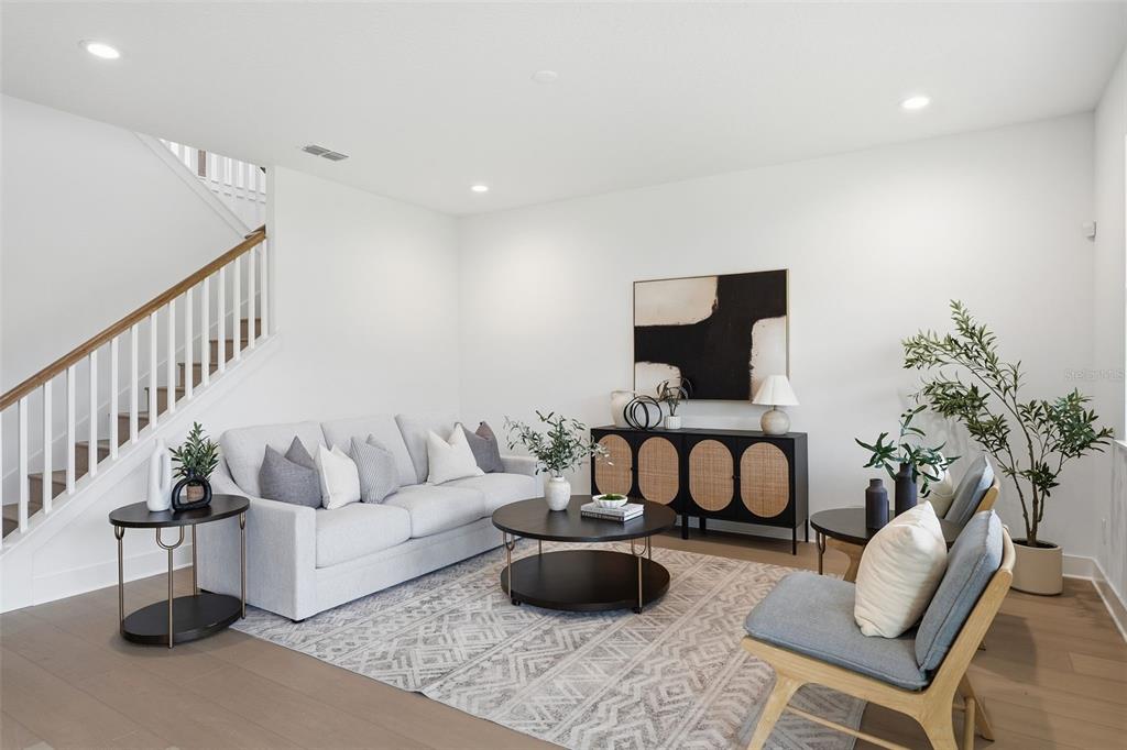 2430 Park Ridge Street Apopka, FL 32712 - Photo 10 of 49 a living room with furniture and a potted plant