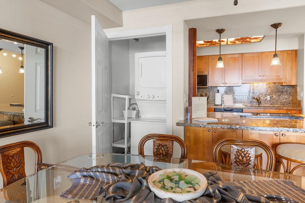 4327 Lower Honoapiilani Road, Unit 403 Lahaina, HI 96761 - Photo 26 of 42 a dining room with furniture a window and kitchen view