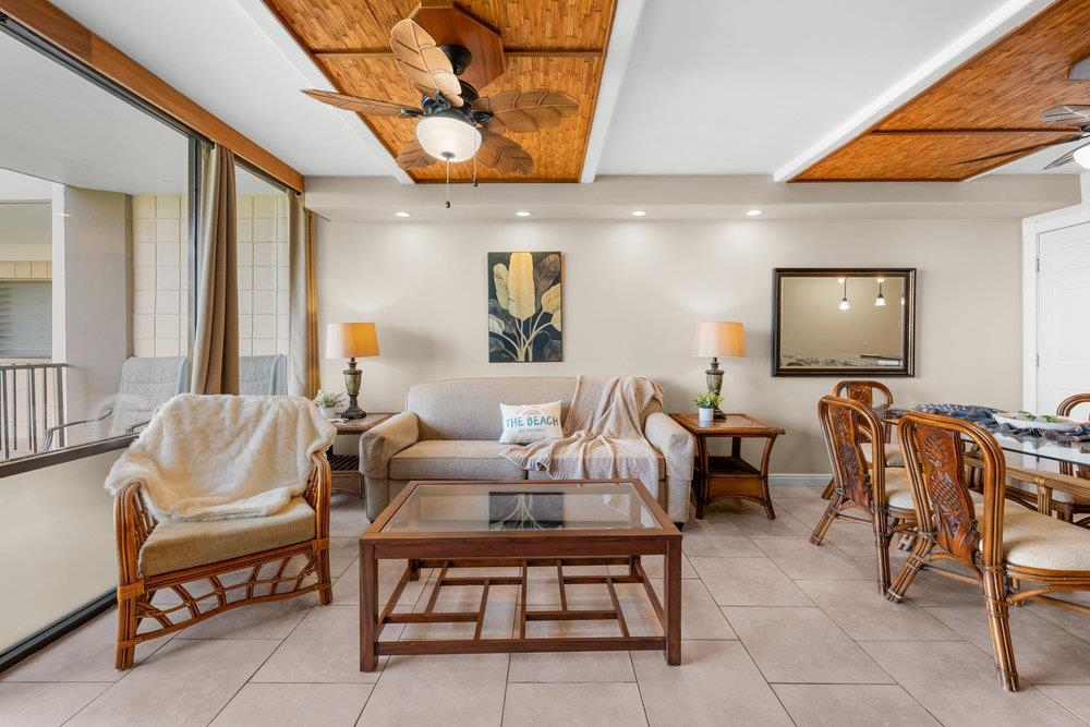 4327 Lower Honoapiilani Road, Unit 403 Lahaina, HI 96761 - Photo 5 of 42 a living room with furniture and a flat screen tv