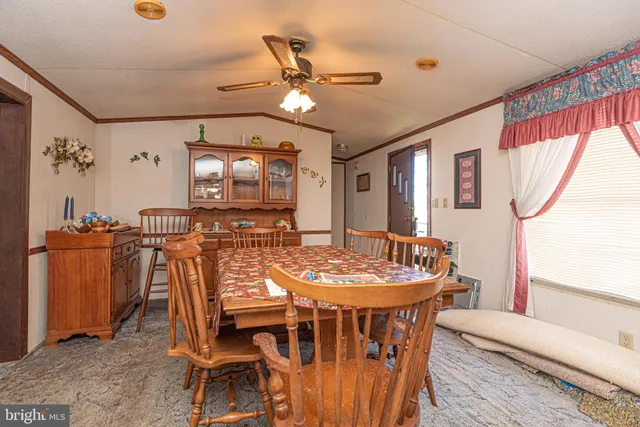 a kitchen with a sink a stove a refrigerator and cabinets
