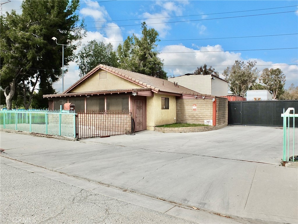 9357 Kruse Road Pico Rivera, CA 90660 - Photo 6 of 11 front view of a house with a garden