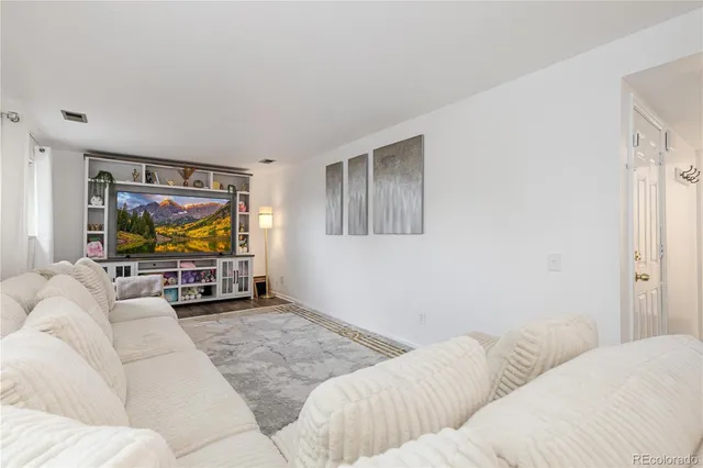 a living room with a couch and a flat screen tv