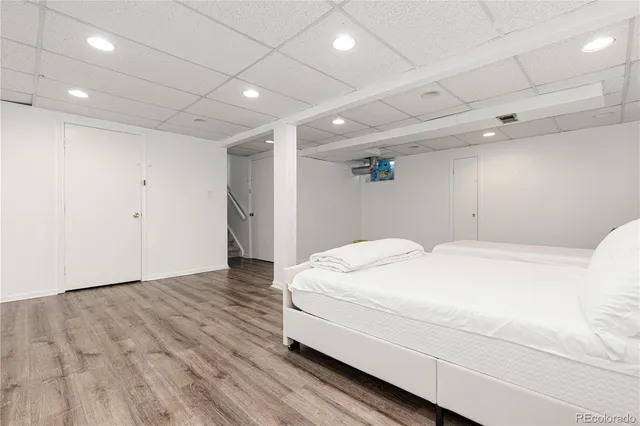 a large white bed in a white room