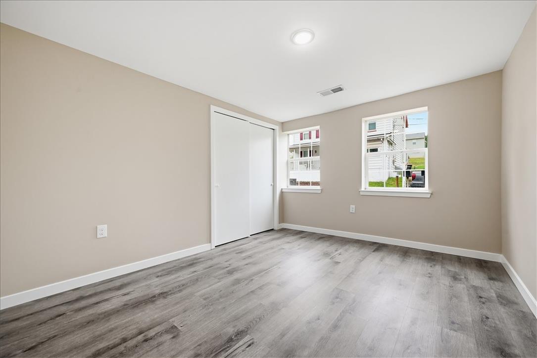 5641 North Coplay Road Whitehall, PA 18052 - Photo 28 of 68 Natural light fills this room featuring durable hardwood flooring and a functional closet.