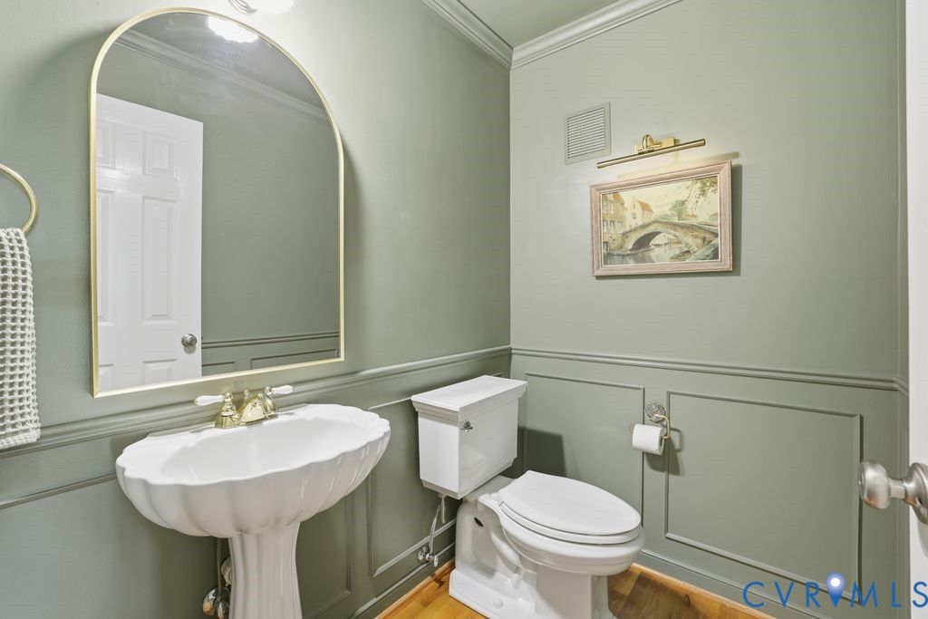 5600 Houndmaster Road Midlothian, VA 23112 - Photo 16 of 46 a bathroom with a toilet a sink and a mirror