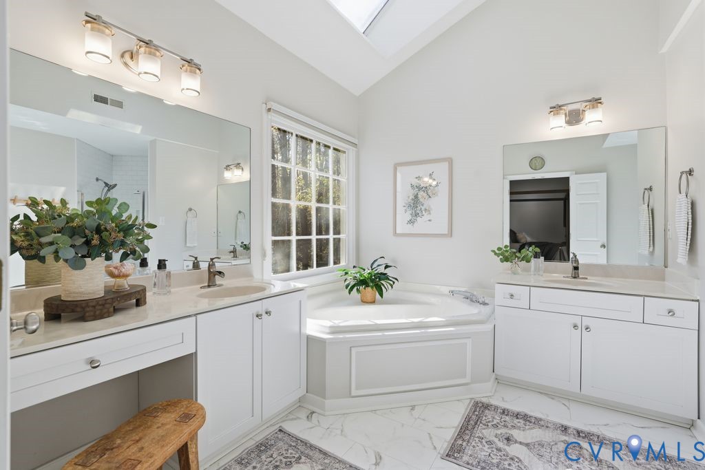 5600 Houndmaster Road Midlothian, VA 23112 - Photo 25 of 46 a bathroom with a sink double vanity and a mirror