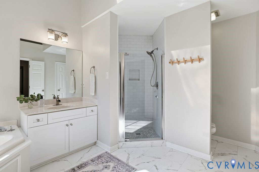 5600 Houndmaster Road Midlothian, VA 23112 - Photo 26 of 46 a bathroom with a double vanity sink mirror and shower