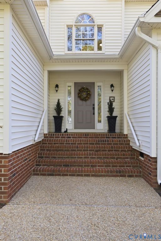 5600 Houndmaster Road Midlothian, VA 23112 - Photo 3 of 46 a front view of a house with large windows