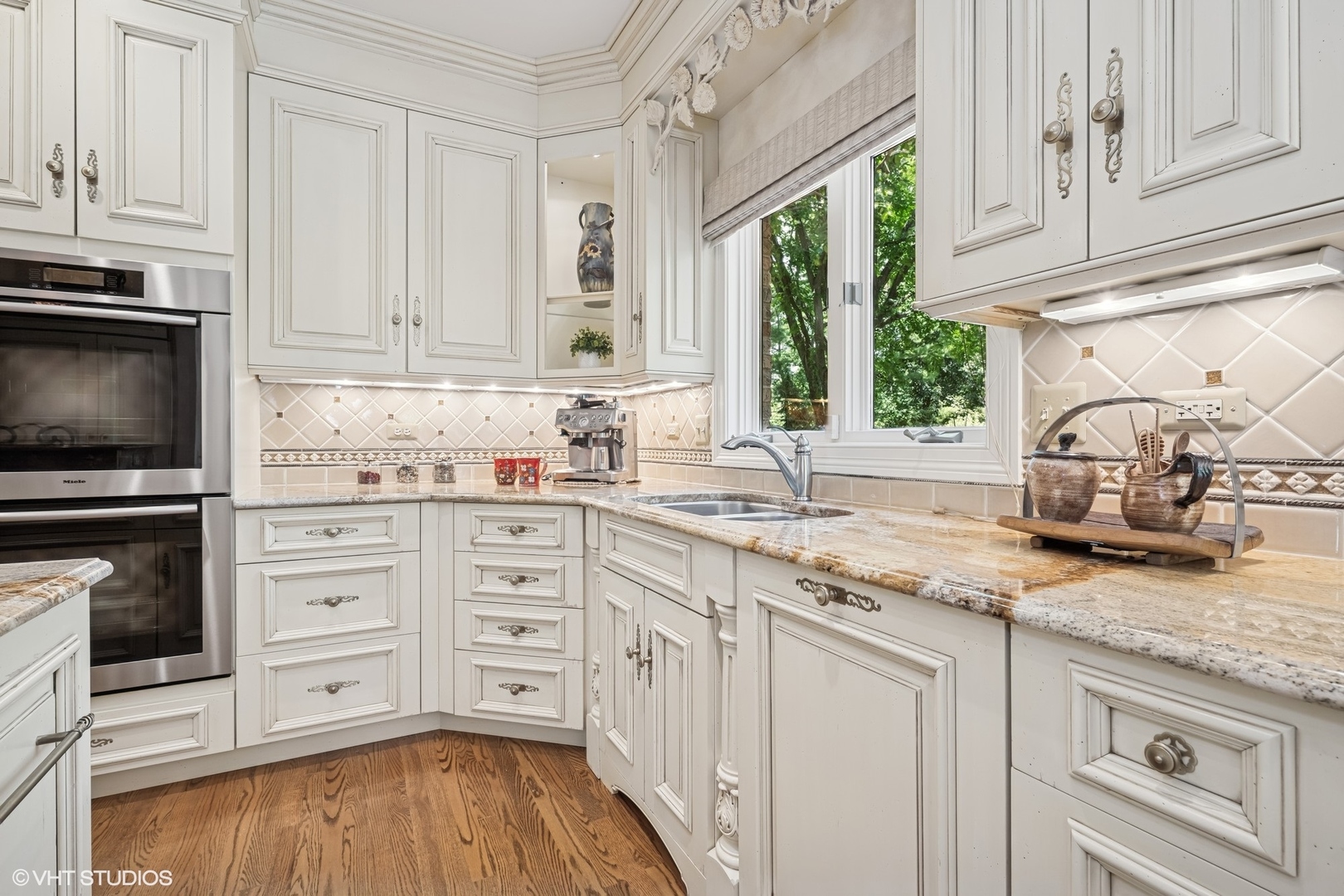 85 Ela Road Inverness, IL 60067 - Photo 13 of 89 a kitchen with granite countertop white cabinets and white appliances