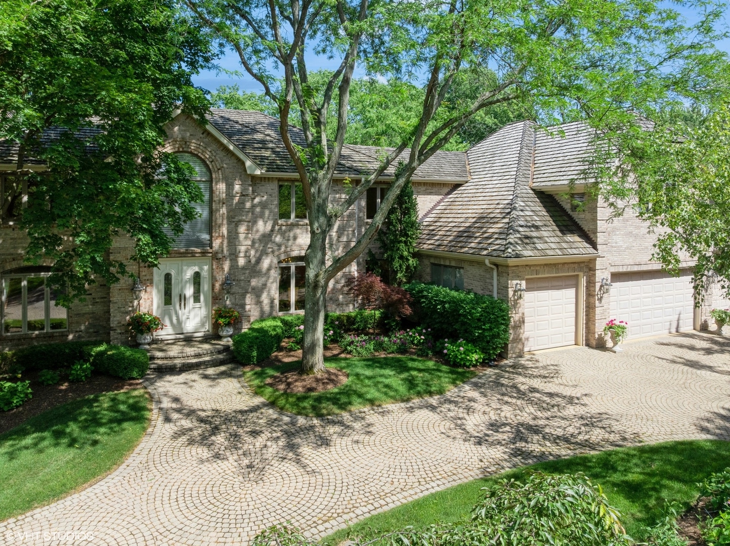 85 Ela Road Inverness, IL 60067 - Photo 2 of 89 a front view of a house with garden