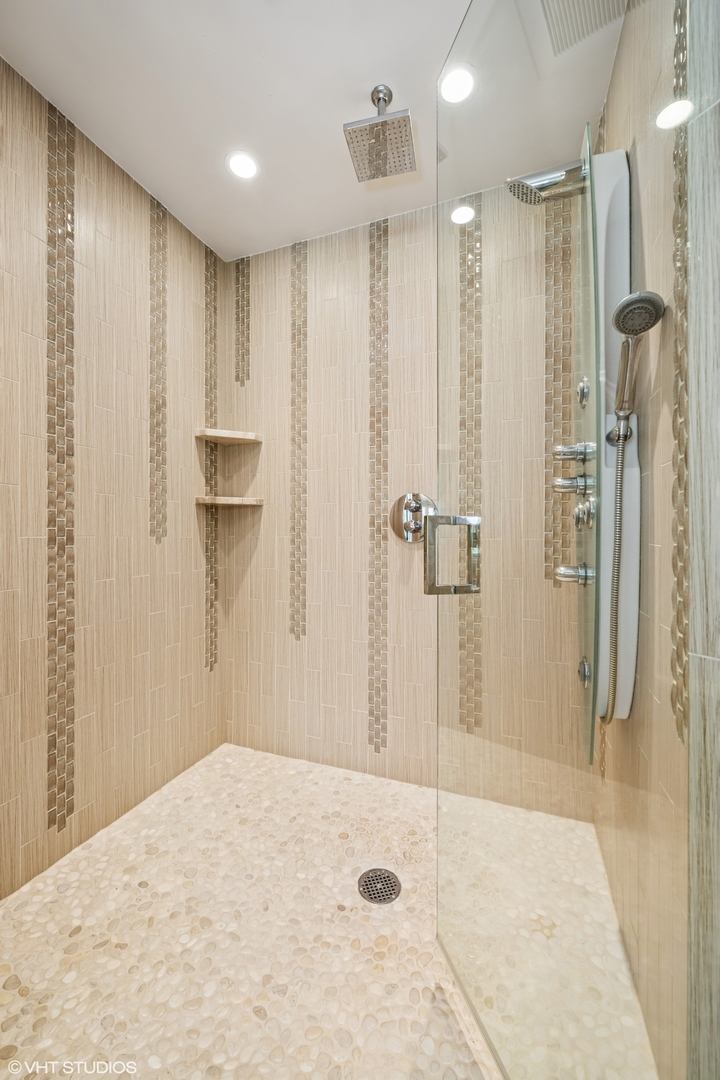 85 Ela Road Inverness, IL 60067 - Photo 42 of 89 a bathroom with a shower and a glass door