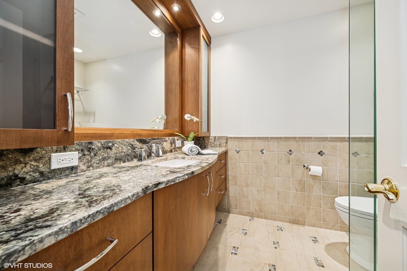 85 Ela Road Inverness, IL 60067 - Photo 50 of 89 a bathroom with a granite countertop sink and a mirror