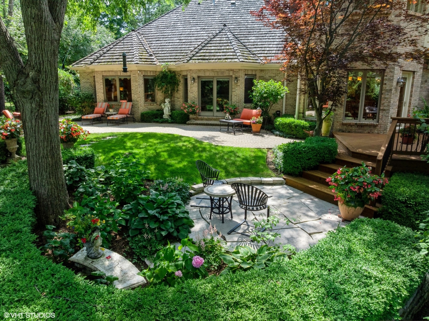 85 Ela Road Inverness, IL 60067 - Photo 69 of 89 a front view of a house with garden and sitting area