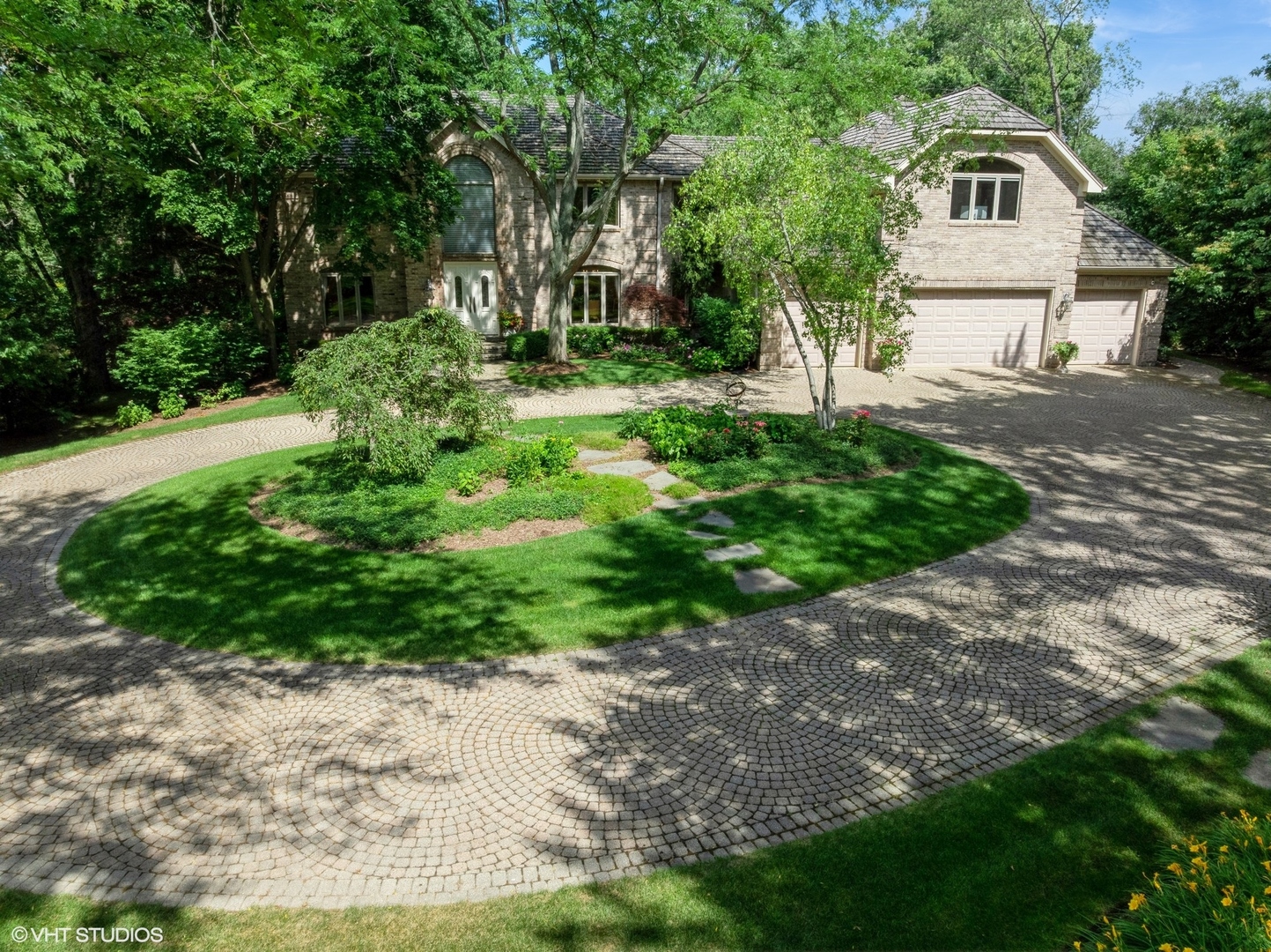 85 Ela Road Inverness, IL 60067 - Photo 80 of 89 a backyard of a house with a garden and outdoor seating