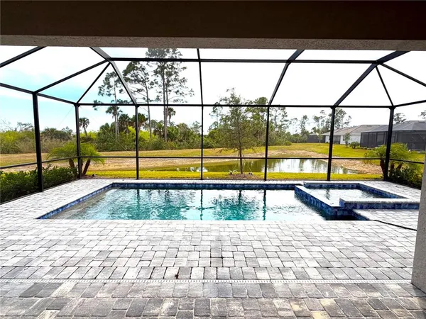 a view of a swimming pool and a porch