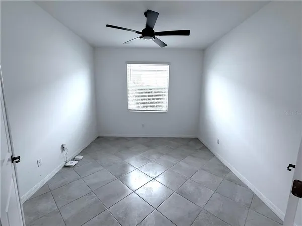 a spacious bathroom with a double vanity sink mirror and double