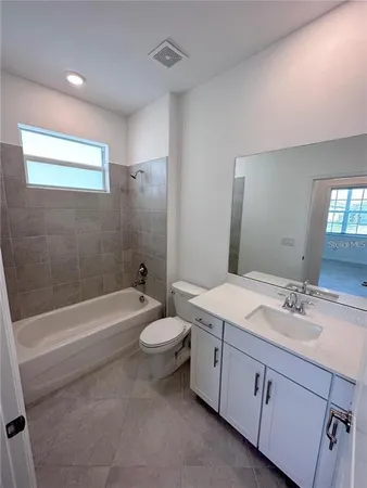 a bathroom with a sink and shower