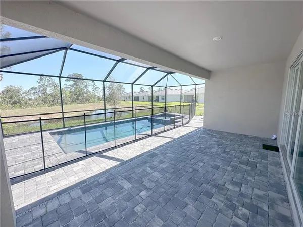 a view of outdoor space with wooden floor