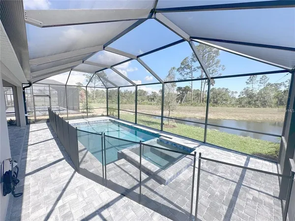 an aerial view of a house with a swimming pool