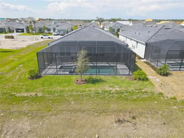 a view of a swimming pool with a yard
