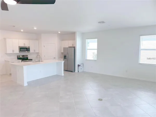 a view of empty room with floor to ceiling window