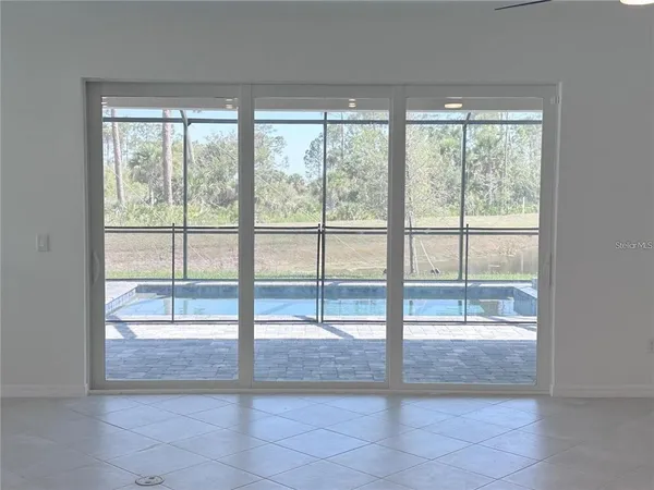 a view of a big room with closet and windows