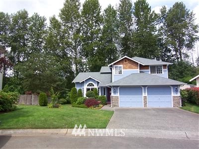 22414 14th Place West Bothell, WA 98021 - Photo 1 of 1 a front view of a house with a yard and garage