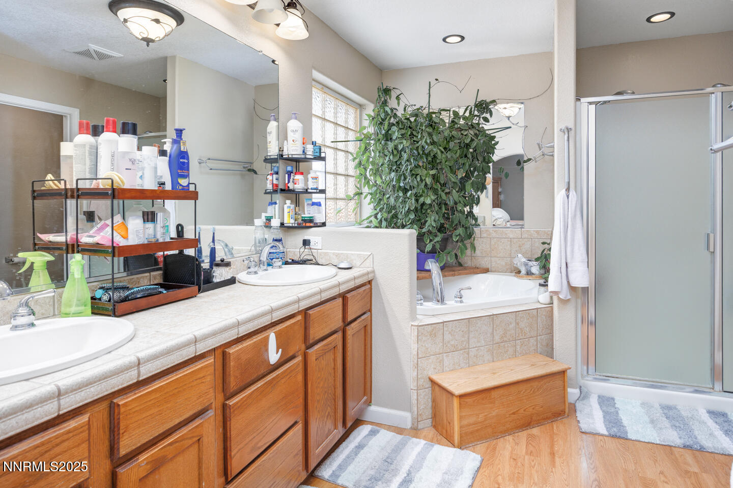 5655 Dillon Drive Fallon, NV 89406 - Photo 15 of 25 a bathroom with a tub sink and glass door
