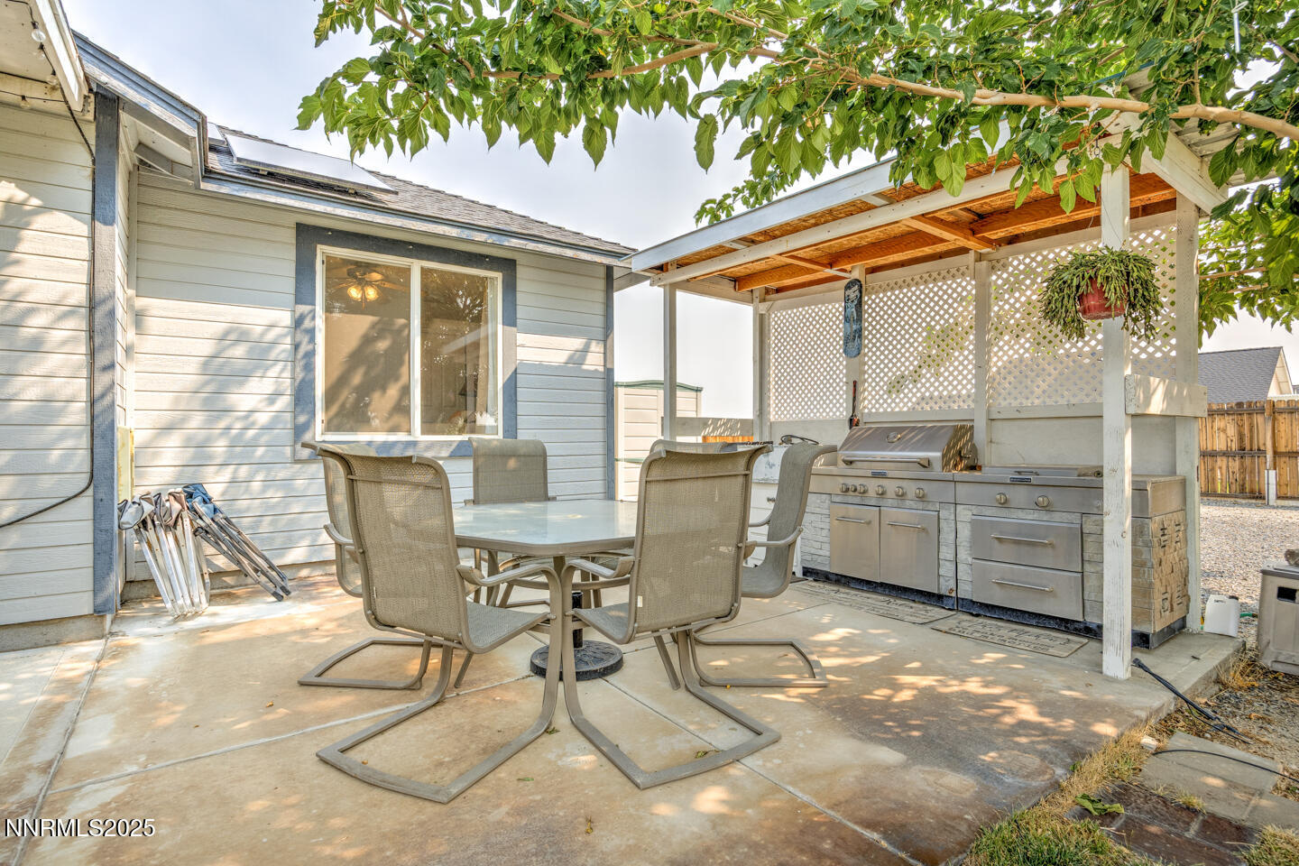 5655 Dillon Drive Fallon, NV 89406 - Photo 19 of 25 a view of a patio with table and chairs and a barbeque